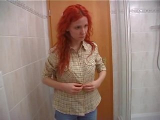 Porner Premium: Readhead babe masturbutes in bathroom.